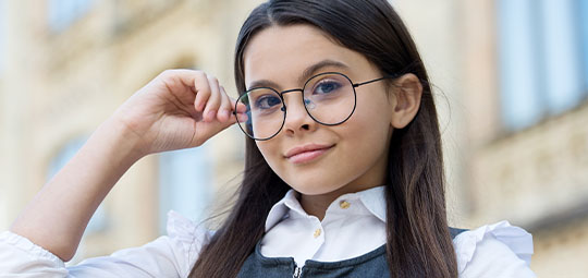 female child wearing glasses